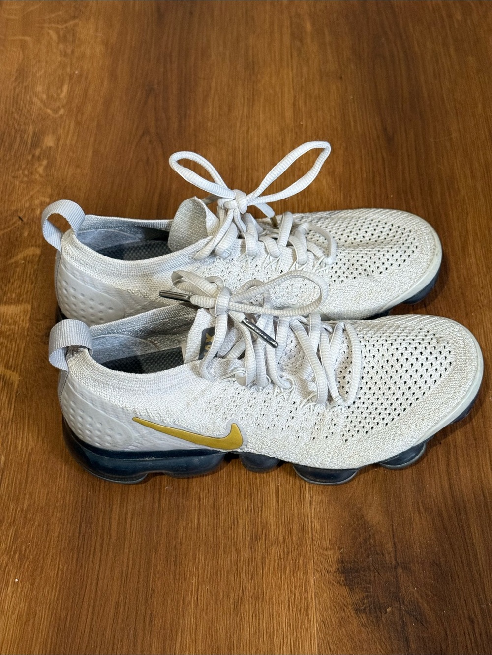 Nike women's White Flyknit Running Shoes with Gold Swoosh